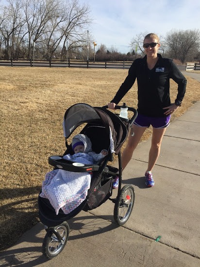 Mom pushing a stroller with baby while out for a walk