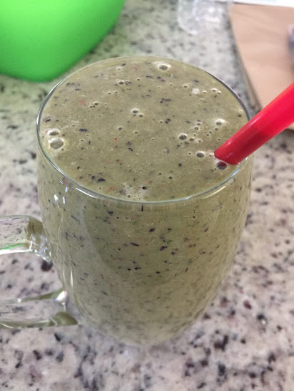 Weekend Smoothie with blueberries, spinach, bananas, strawberries, chia seeds, protein powder, ice, and water