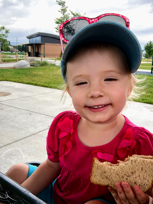 Zoey at the Park eating a sandwich