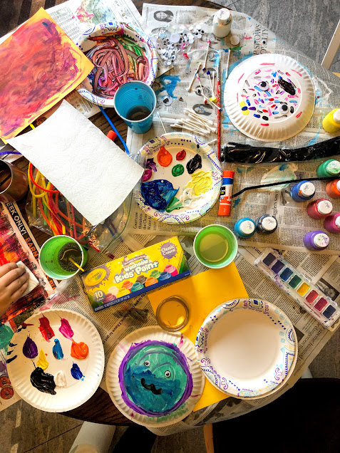 Mess on a table from painting for  29 beginner craft projects for young kids