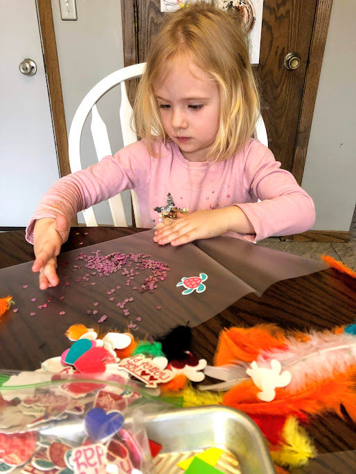 Girl making placemats for  29 beginner craft projects for young kids