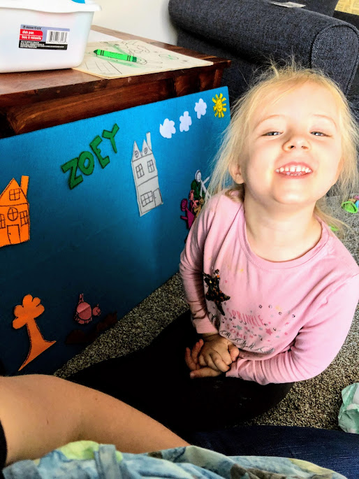 Girl in front of felt board for  simple dramatic play ideas for young kids
