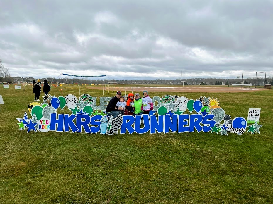 Family in front of sign gypsy words