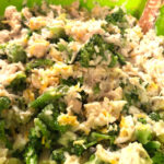 chicken broccoli rice casserole in a green mixing bowl for new moms freezer meals