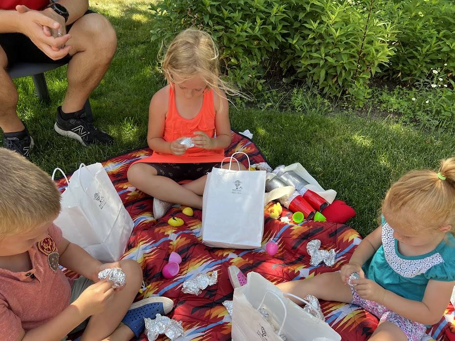 outer space themed party opening moon rocks to find prizes outside