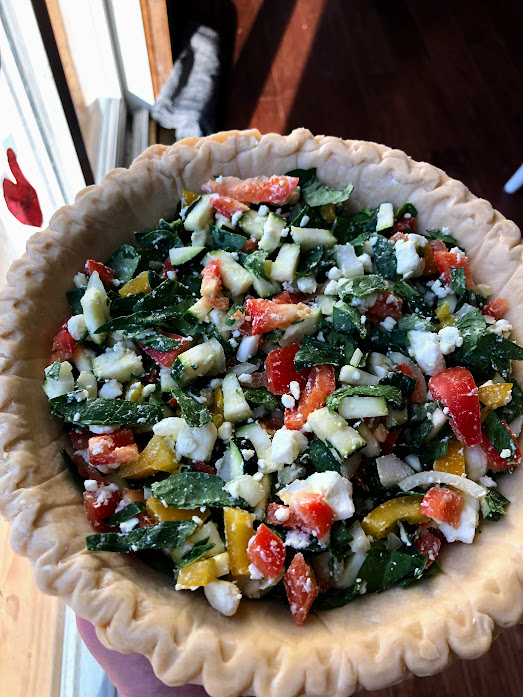 Egg pie filling inside a crust before eggs are added