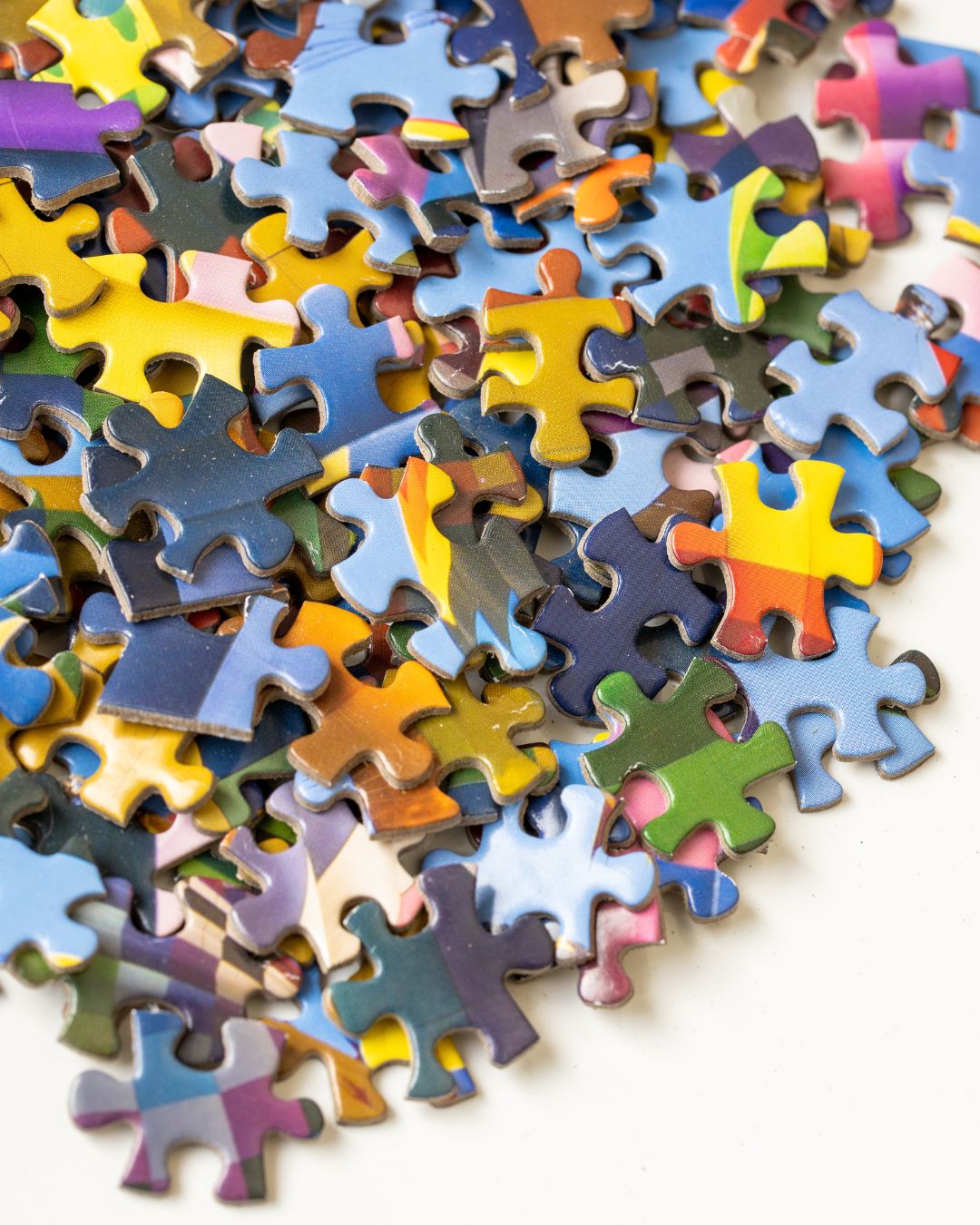 puzzle pieces in a pile for puzzles races you can do at home for a date night